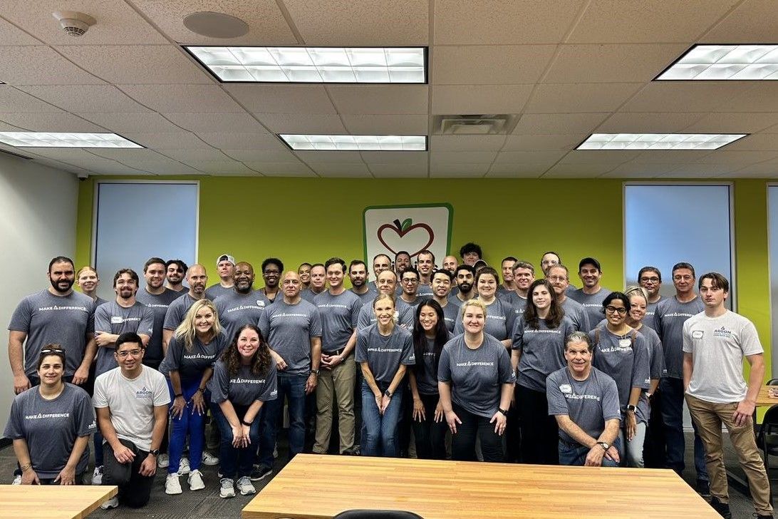 employees posed together smiling