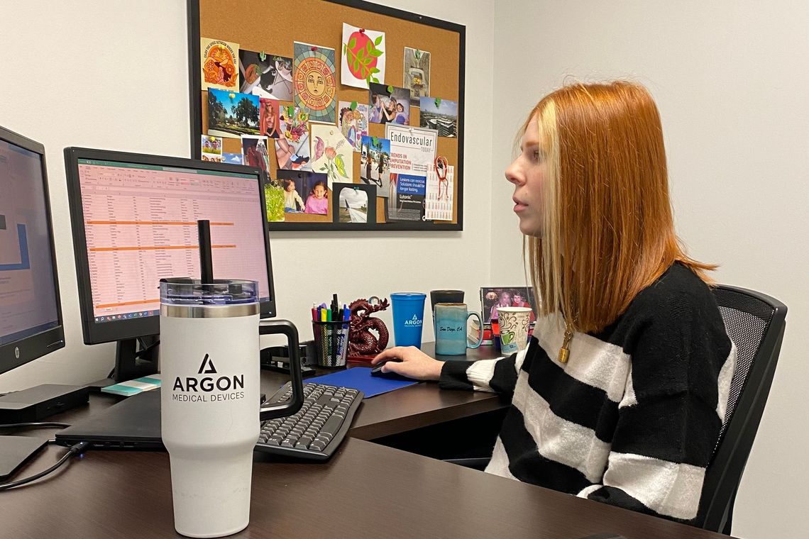 intern at a computer set up on desk